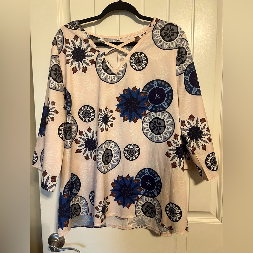 A beautiful blouse to tuck into a high waisted skirt or pant.